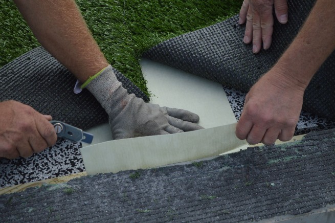 Augusta artificial turf installation - cushion pad installation